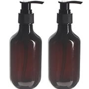 two amber PET bottles with black lotion pumps